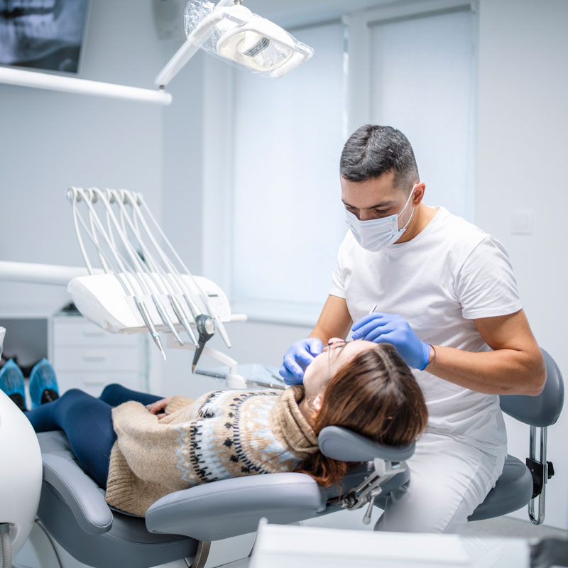 dentist performing procedure on patient